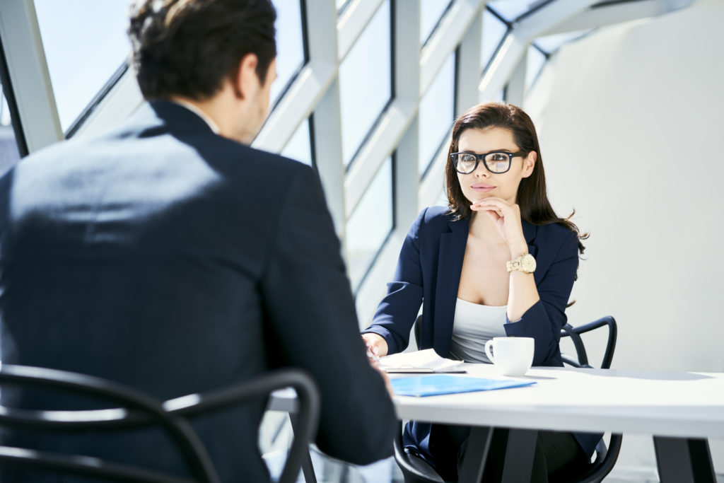 Businesswoman talking to another person